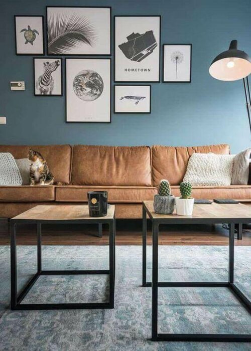 A living room with a blue wall.