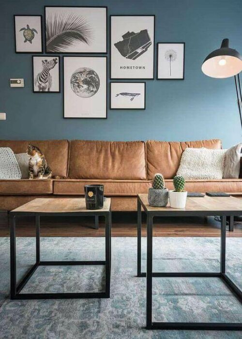 A living room with a blue wall.