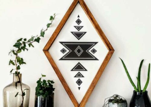 A geometric patterned frame with some plants.