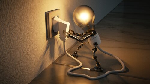 A light bulb robot plugging itself in.
