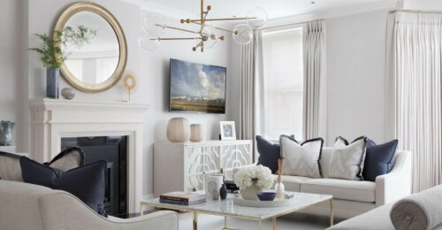 A living room with some modern furniture.