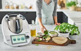 A person making a dish with their food processor.