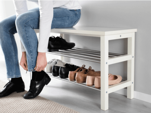 A person putting on a pair of shoes.