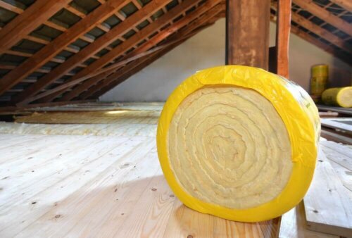 A roll of insulation in an attic.