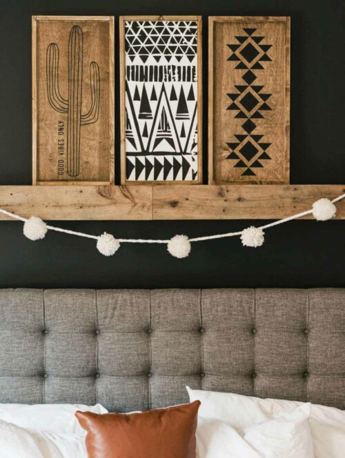 A shelf with some Aztec style prints.