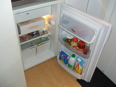 An open fridge which is a bad way to reduce energy consumption.