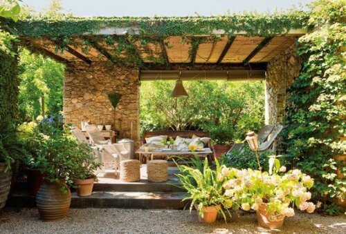 An outdoor patio full of plants.