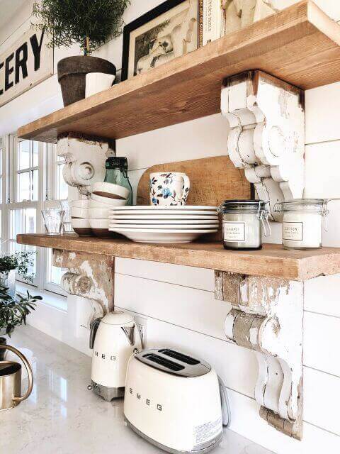 Some wooden shelves with plates.