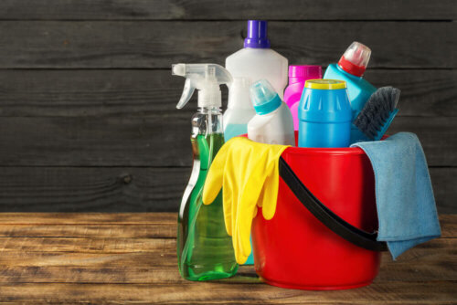 A bucket with cleaning products.