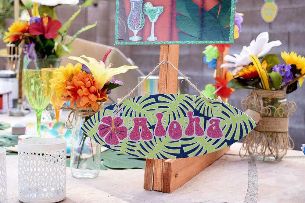 Set the table a certain way to achieve a Hawaiian theme.