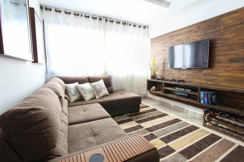 Shows a large sectional sofa in brown