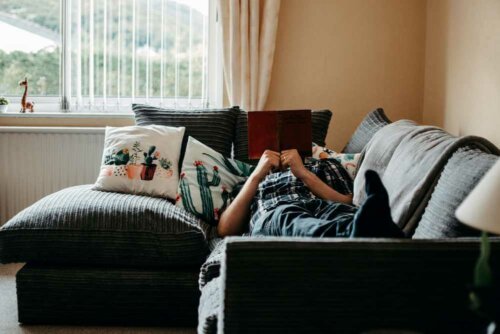 Tan living room with a dark gray sectional couch