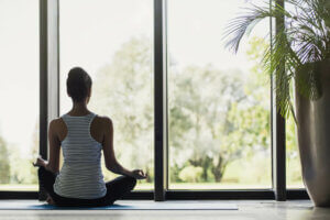 A woman meditating.