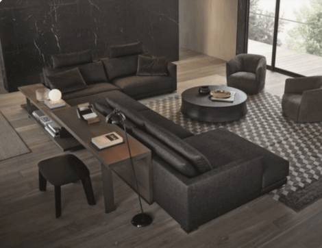 A desk behind a sofa to increase space in your living room