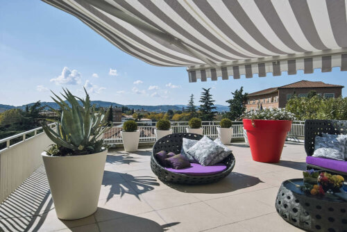 A terrace with an awning.