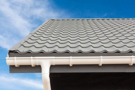 Roof showing white rain gutters