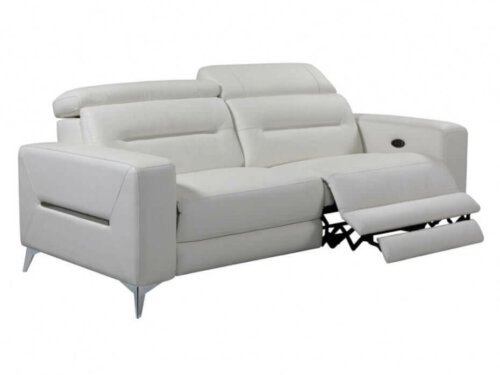 A couch with a footrest.