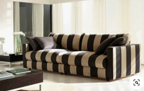 A large sofa in a living room.