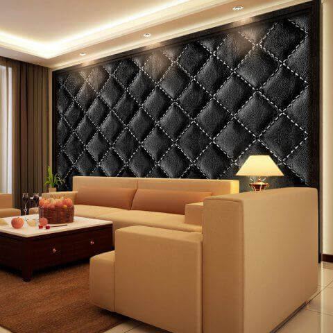 A living room with a padded wall.