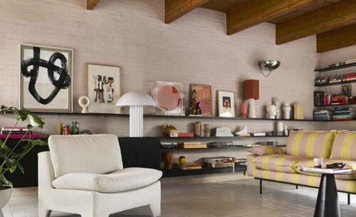 A modern living room with some striped sofas.