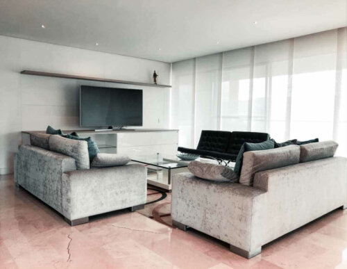 A very modern living room with a large television.