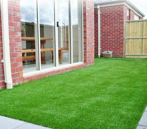 An outdoor lawn with artificial grass.