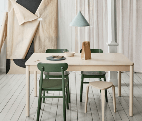 A small dining room with a small table