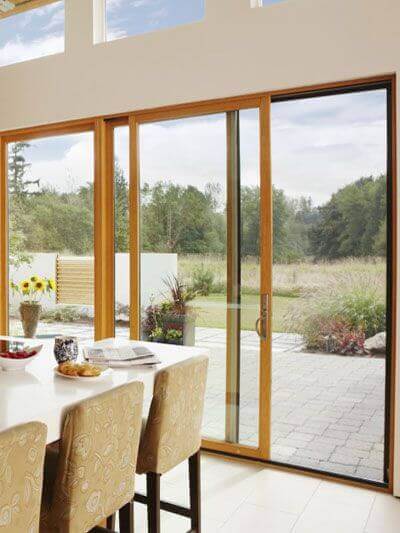 A dining room with folding doors.