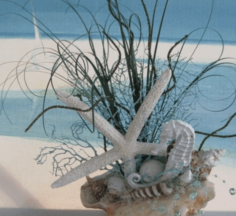 an arrangement with a sea plant to illustrate starfish motif