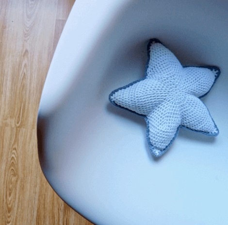 a stuffed and crocheted starfish motif