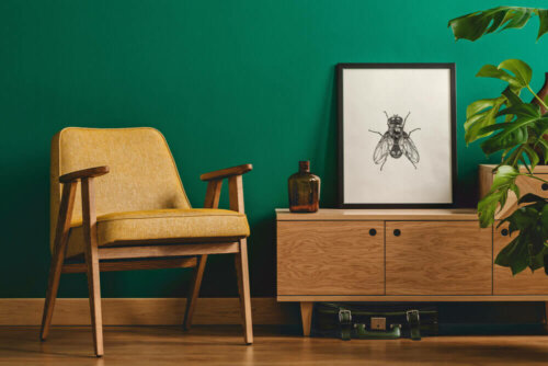 A living room with wood and the color green.