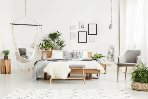 A simple bedroom with plants.