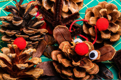 Some reindeer made from pinecones are some DIY Christmas decorations.