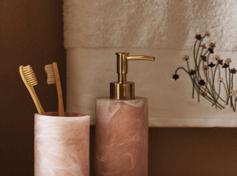 Toothbrush holder and soap dispenser in a modern bathroom
