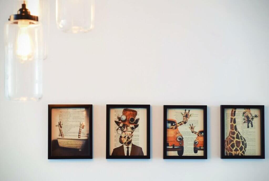 Four paintings on a wall.