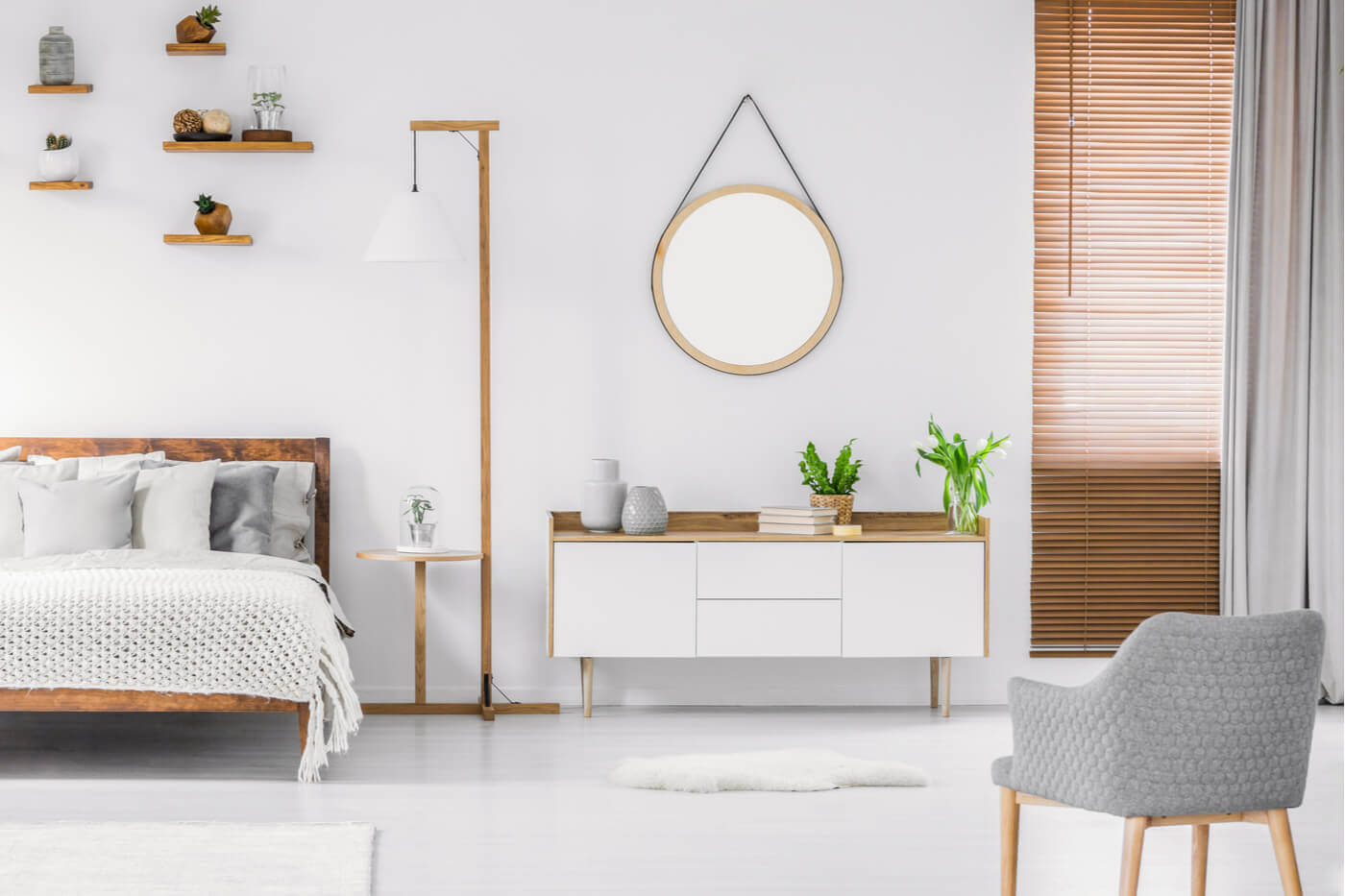 A white sideboard in a bedroom.