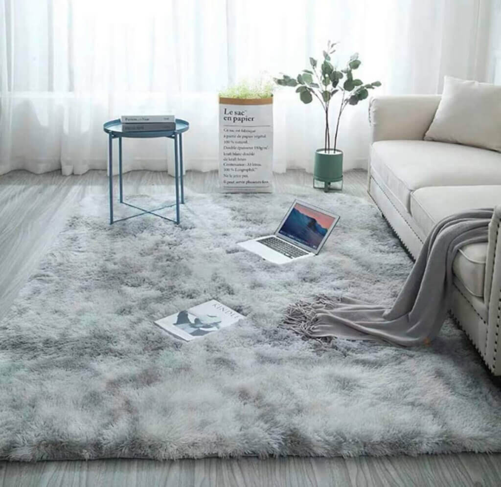 A gray shaggy rug.