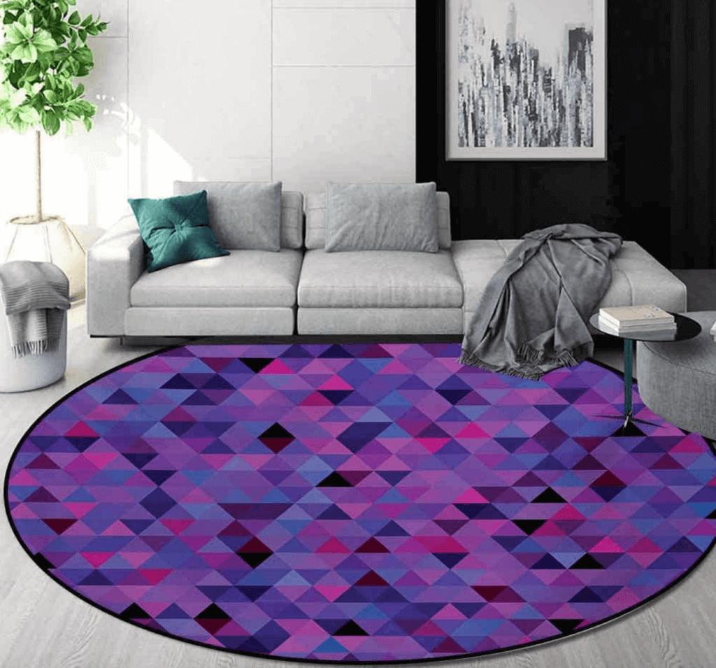 A gray living room with a purple rug.
