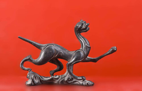 A sculpture of a magical cat.