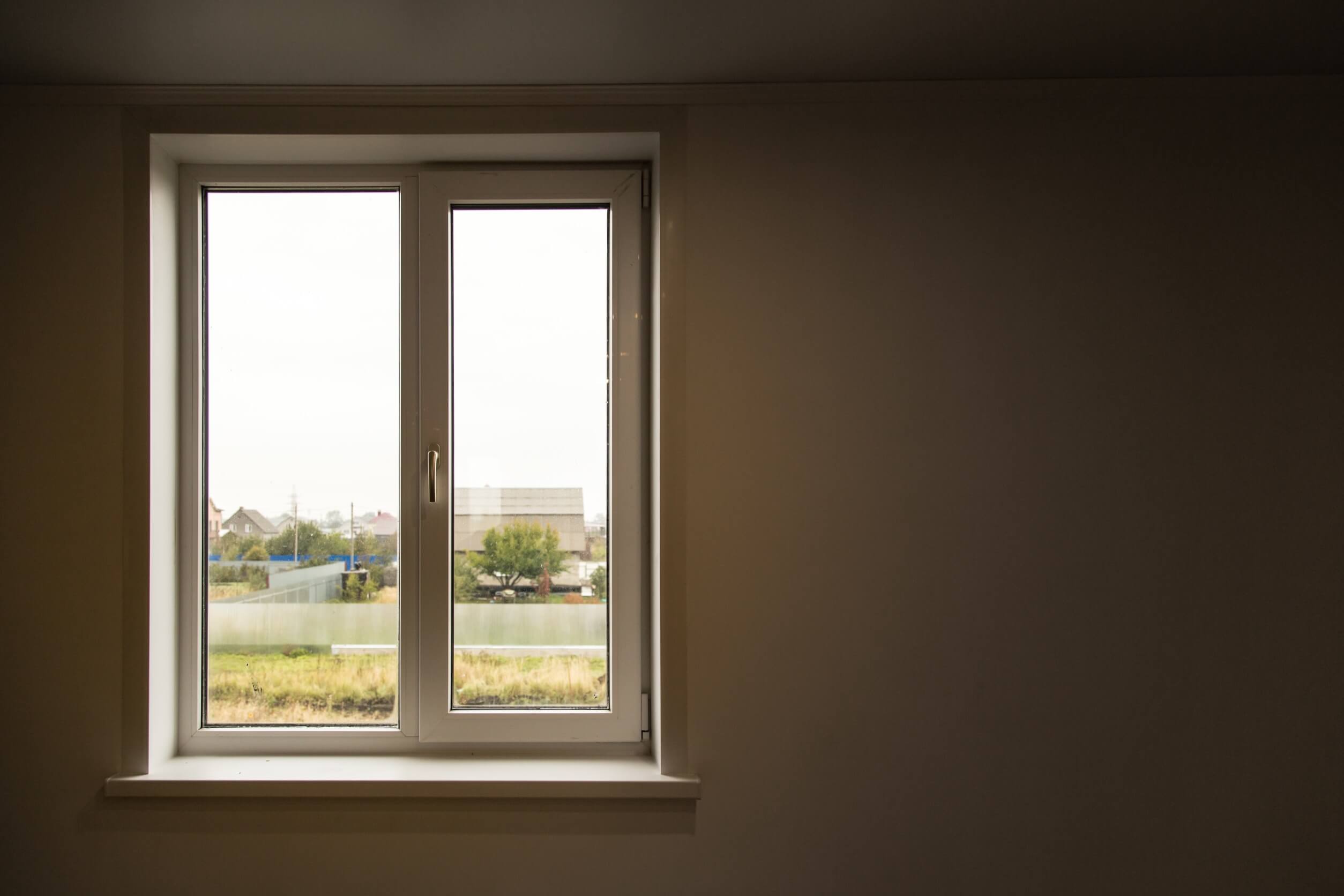 Aluminum windows overlooking a neighborhood.
