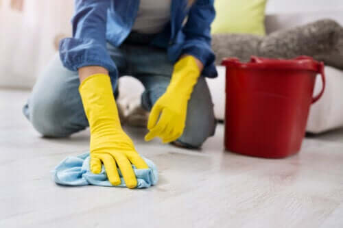 A person scrubbing a floor.